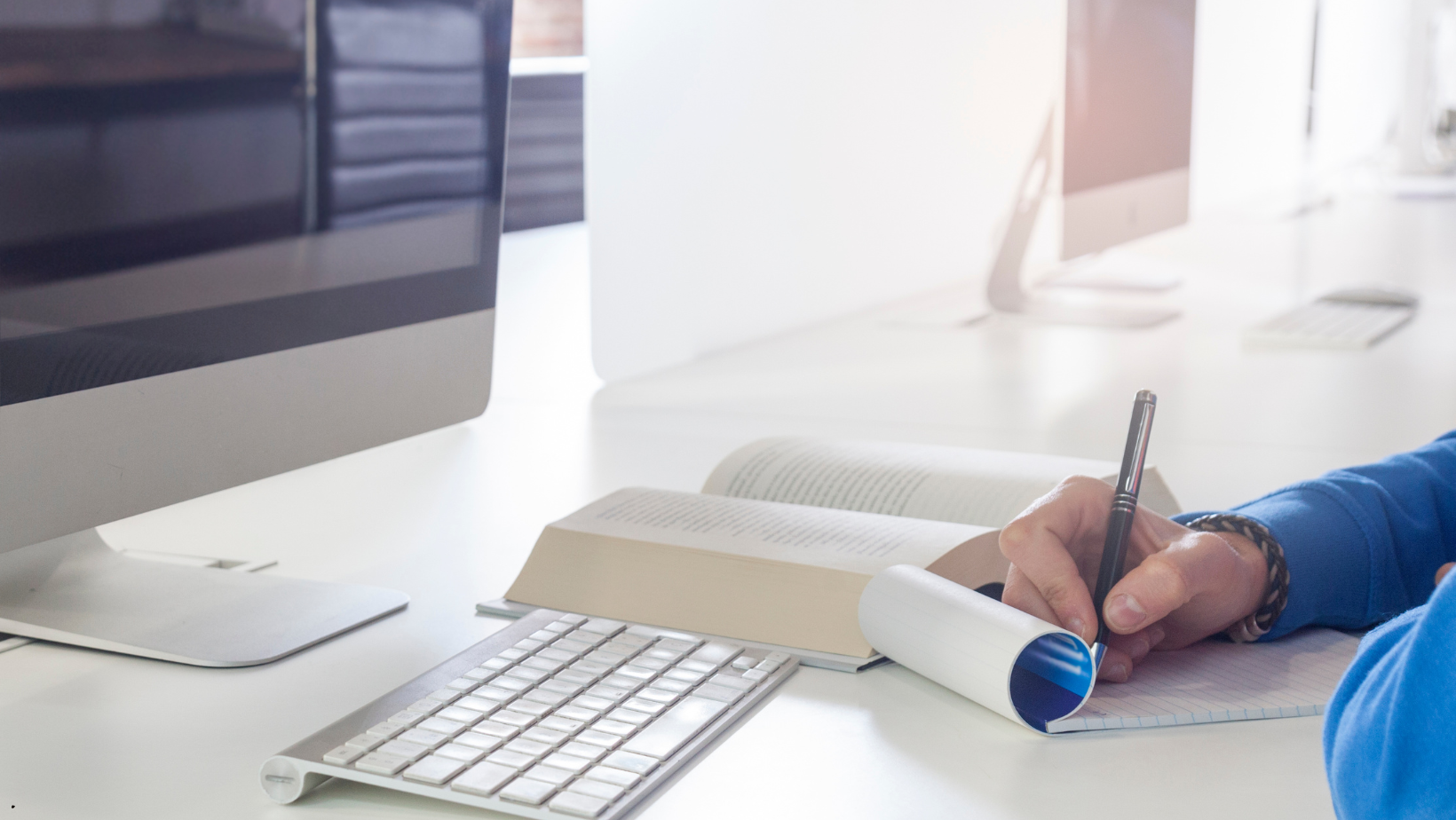 writing in front of computer