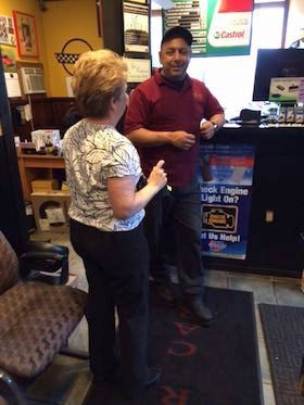 Our Owner With a Client - Lakeview Car Care