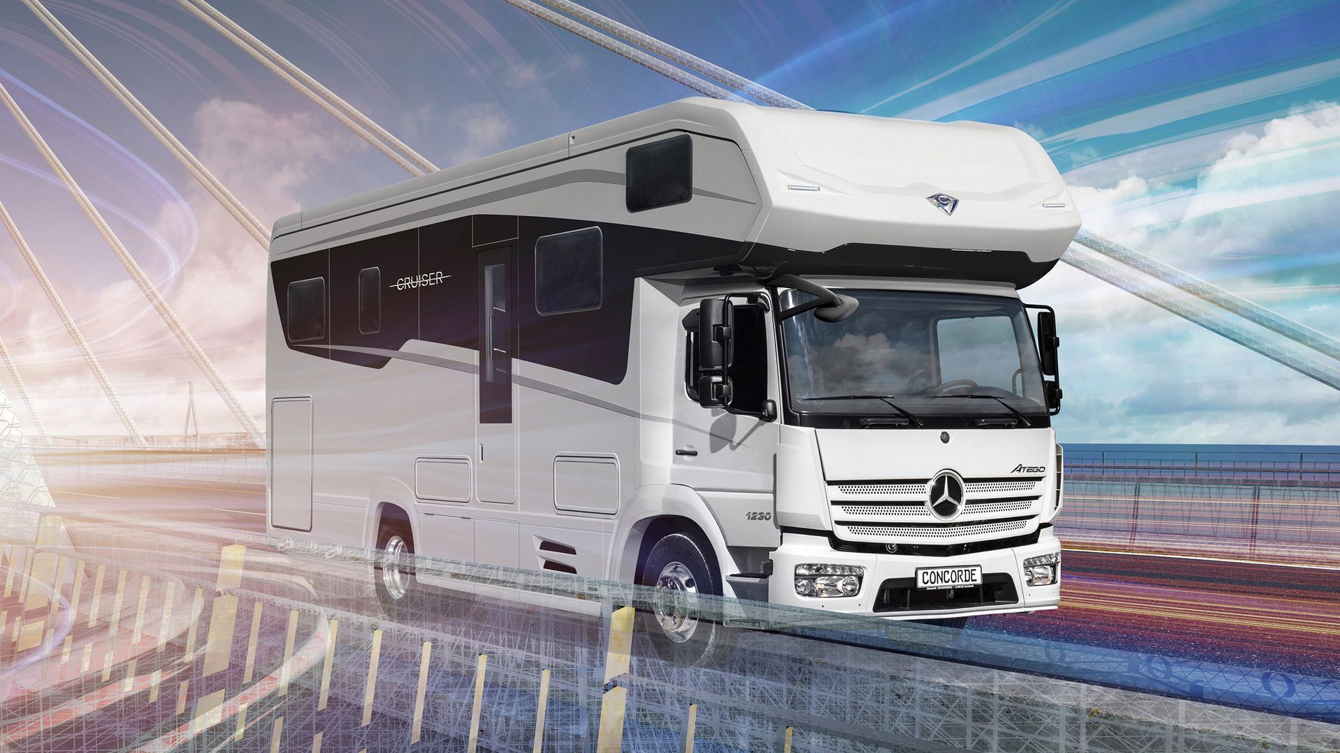 Hvit Mercedes-Benz bobil kjører på en bro over vann med en uskarp, fargerik bakgrunn.