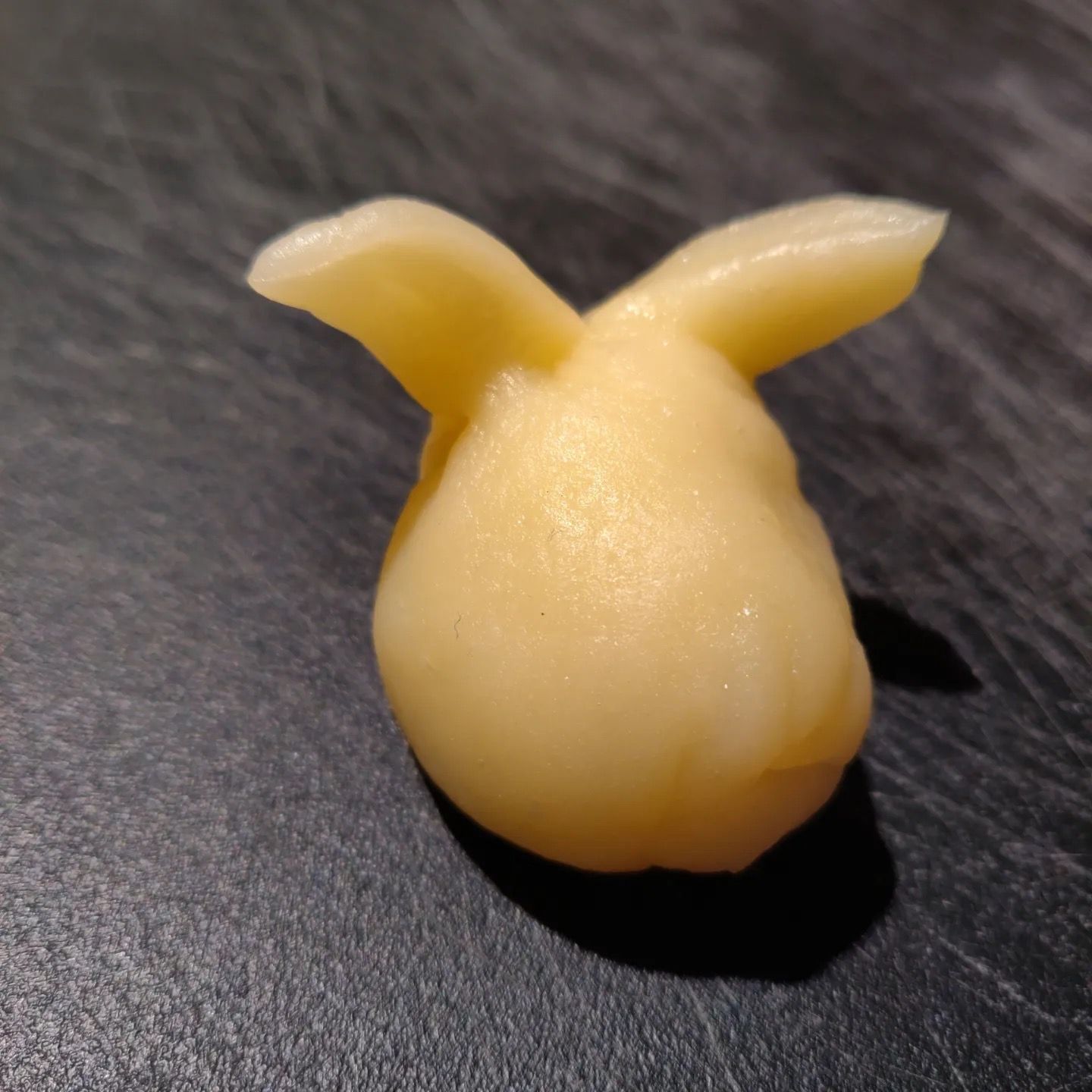 A close up of a piece of food that looks like a rabbit