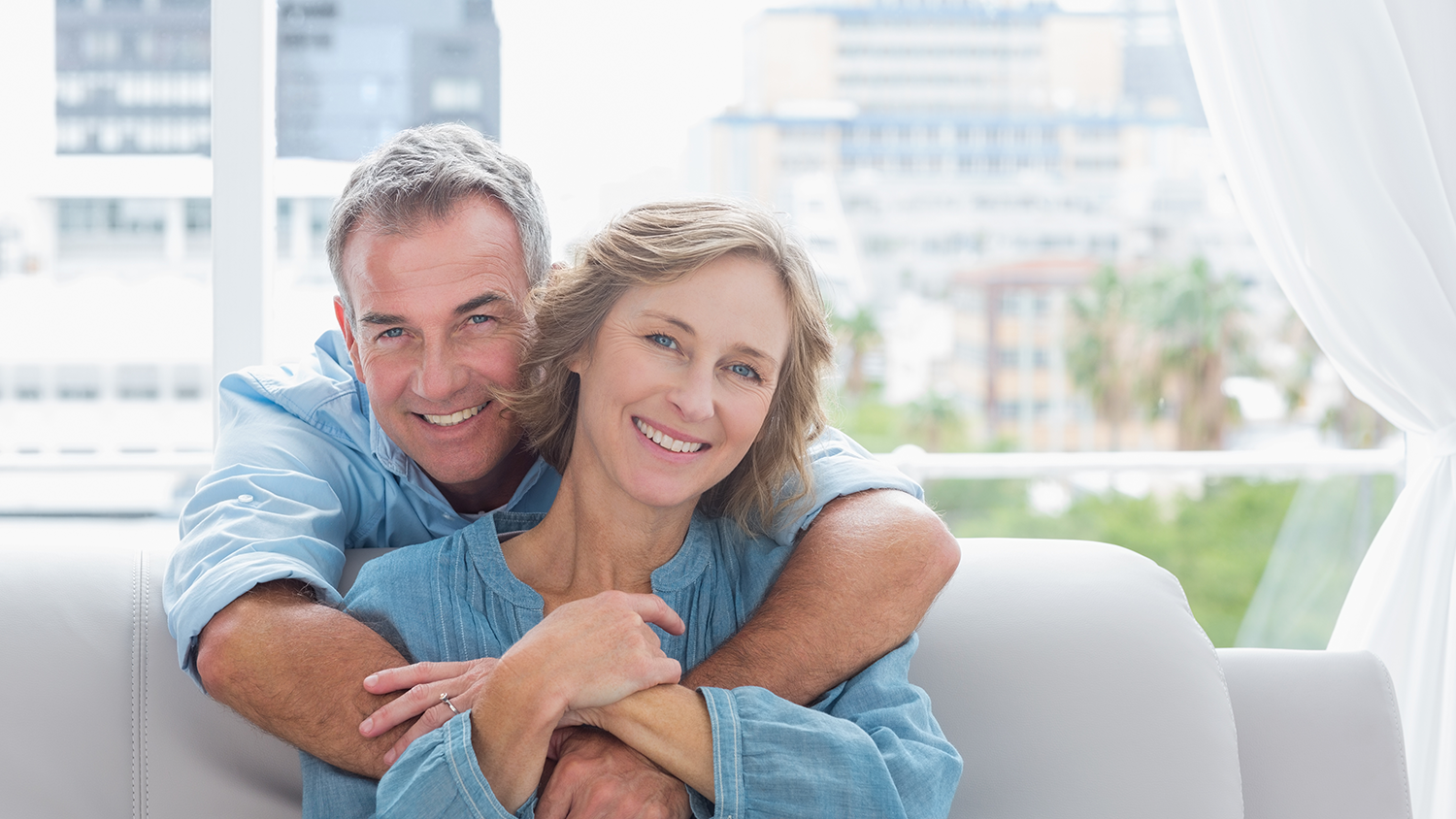 happy couple smiling with bright white teeth