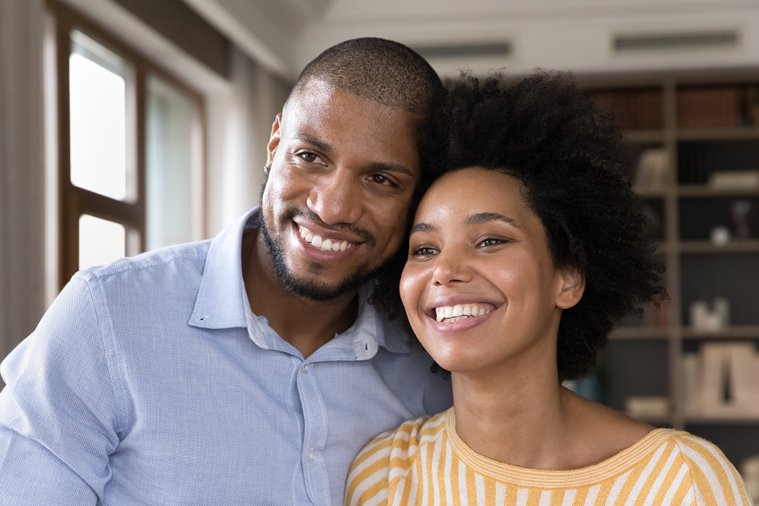 happy couple pictured smiling with white teeth