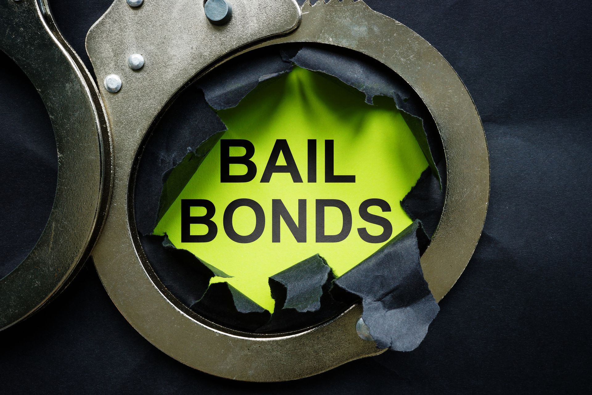 Bail bonds inscription and handcuffs. - Bail Bond Companies