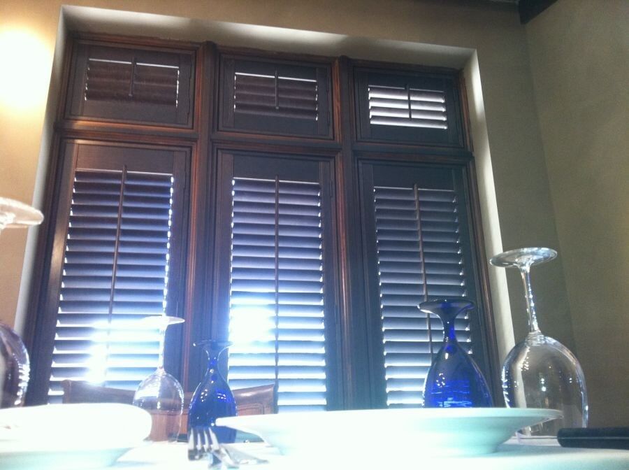 Wood Blinds Partially Closed — Window Treatments Showroom in Destin, FL