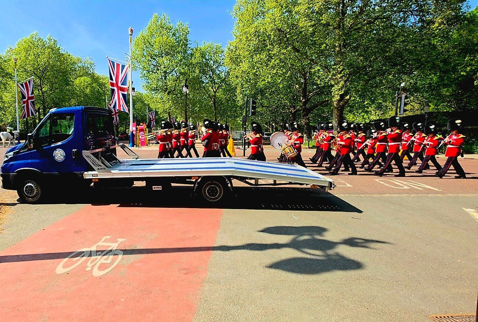 Refrigerated trailer and transport truck outside Buckingham Palace