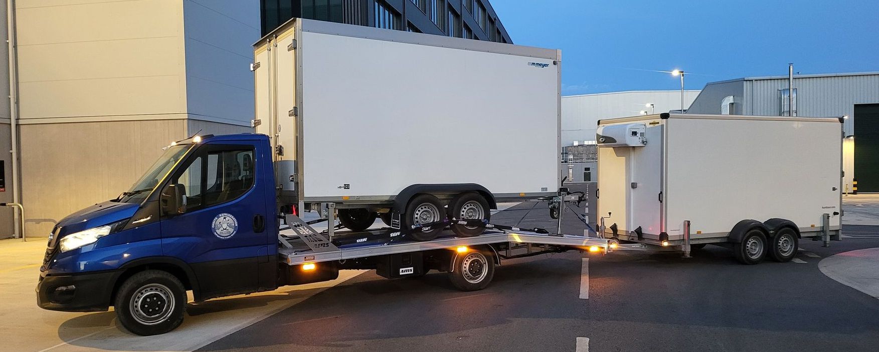 two trailers transported on truck