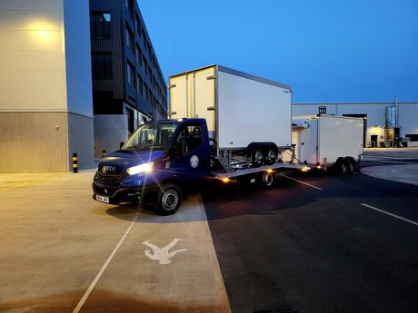 Beavertail truck transporting two refrigerated trailers at Shepperton Studios