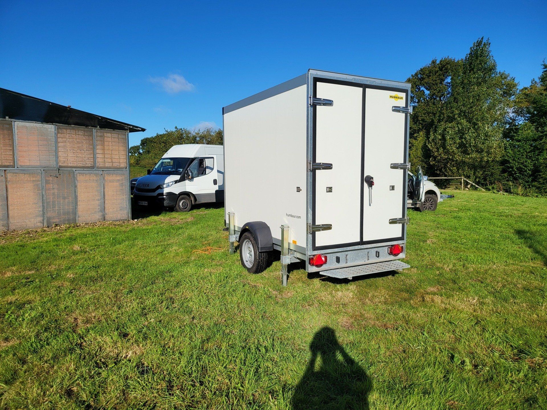 small fridge trailer in a field