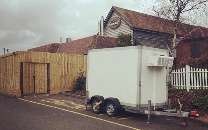 fridge trailer outside harvester restaurant