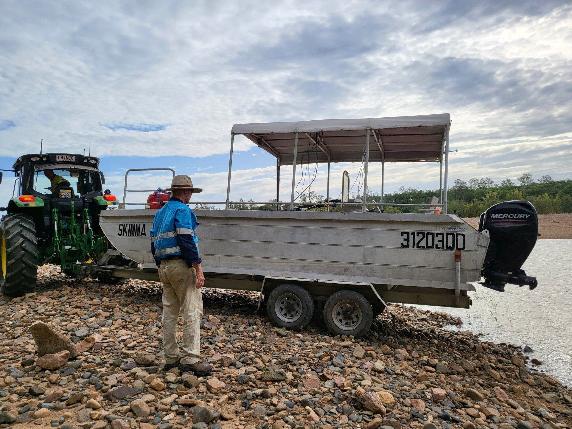 A Man with a Blue Uniform and a Boat | Townsville, Qld | Aquamap Pty Ltd Trading as Aquamap Hydrographic Services