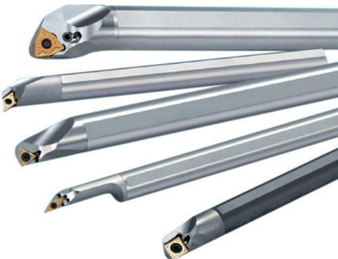 A bunch of different types of drill bits on a white background