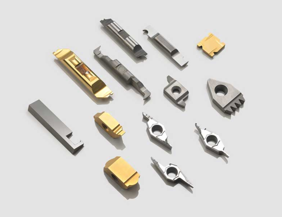 A bunch of different types of metal pieces on a white surface