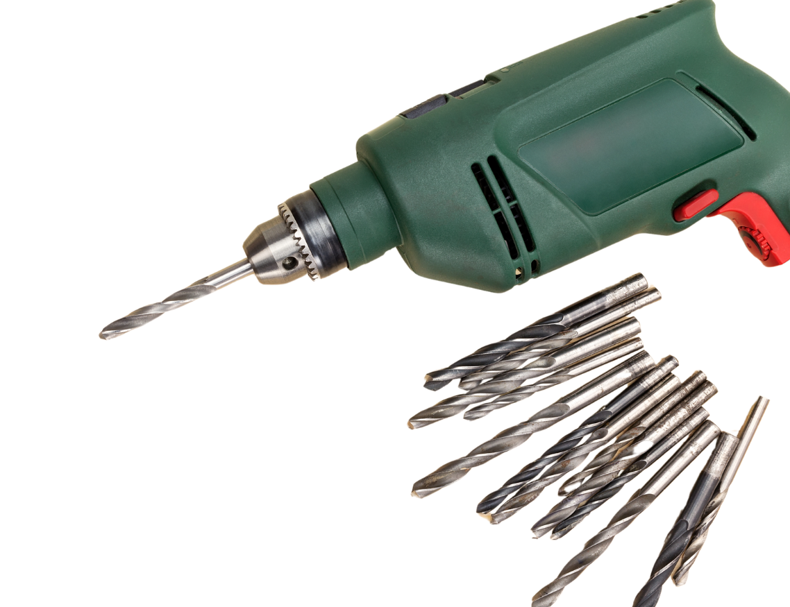 A green drill next to a bunch of drill bits