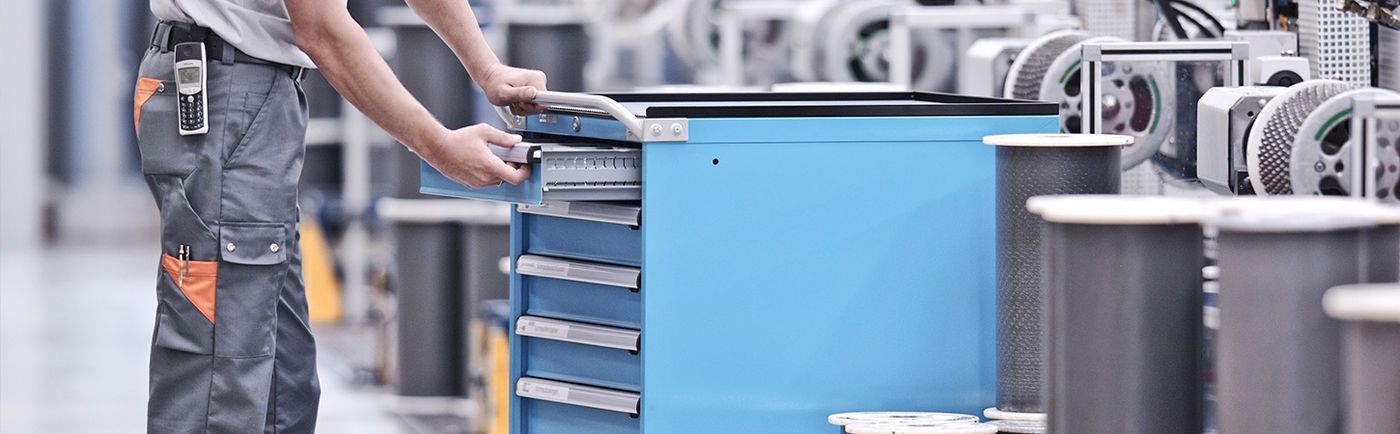 A close up of a machine tool on a black surface.