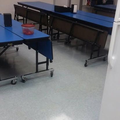 clean floor and table In cafeteria for high school 