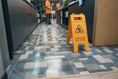 worker cleaning in office