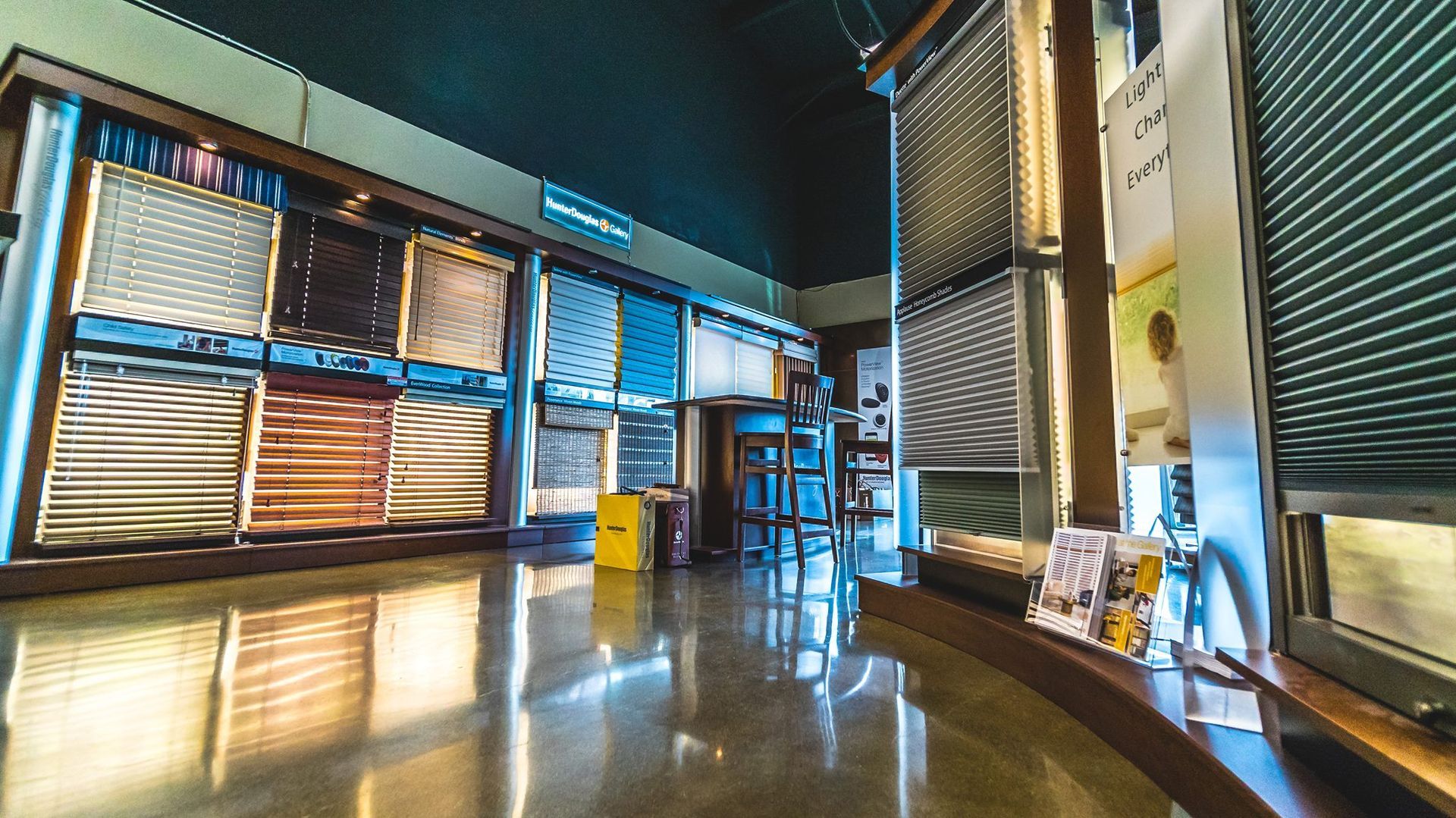 Walls & Windows window treatment showroom in Bellingham, WA featuring various Hunter Douglas window blinds and shades