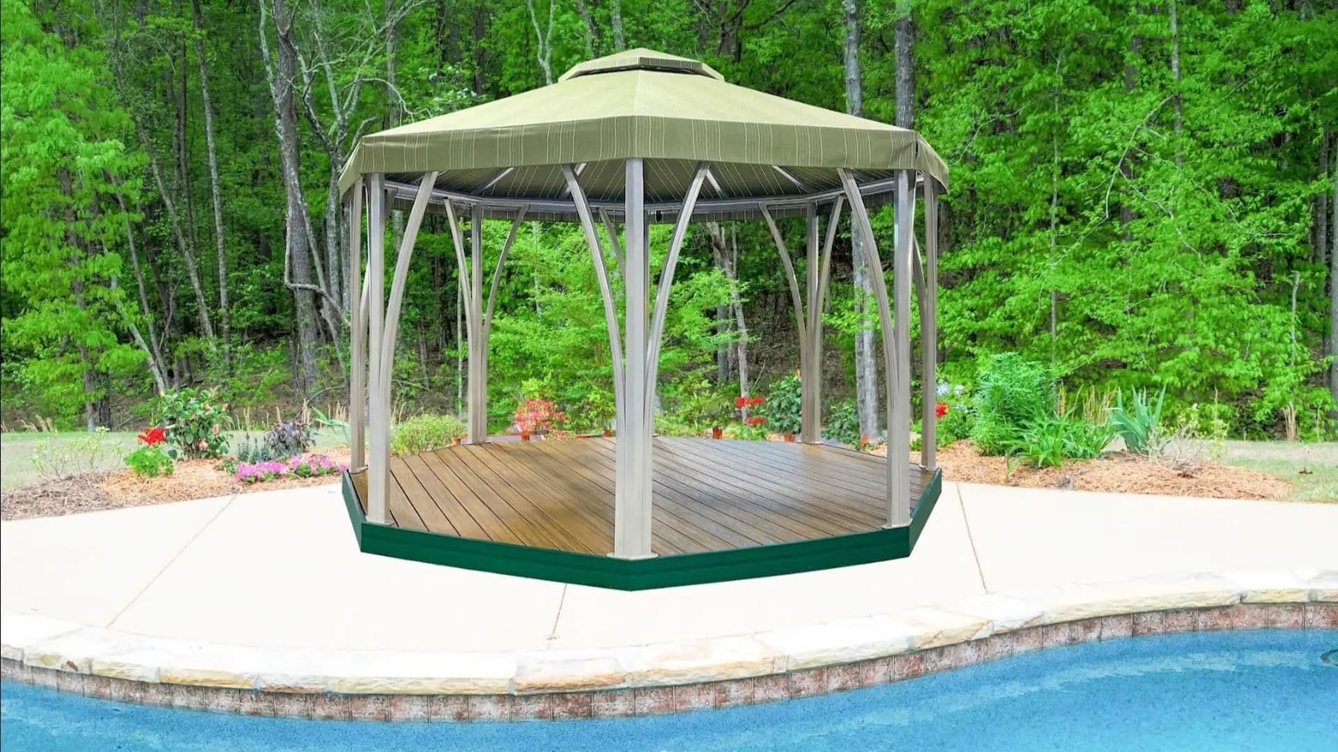 An octagonal gazebo with a beige canopy and arched supports sits on a wooden deck by a backyard swimming pool.