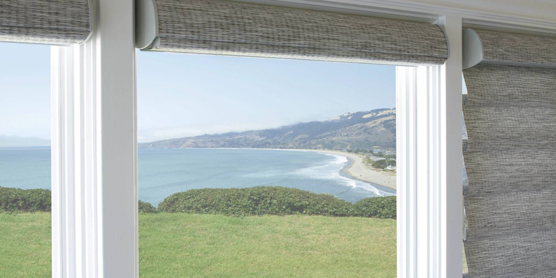 Hunter Douglas Vignette® Roman Shades rolled up on two windows and closed on the third 