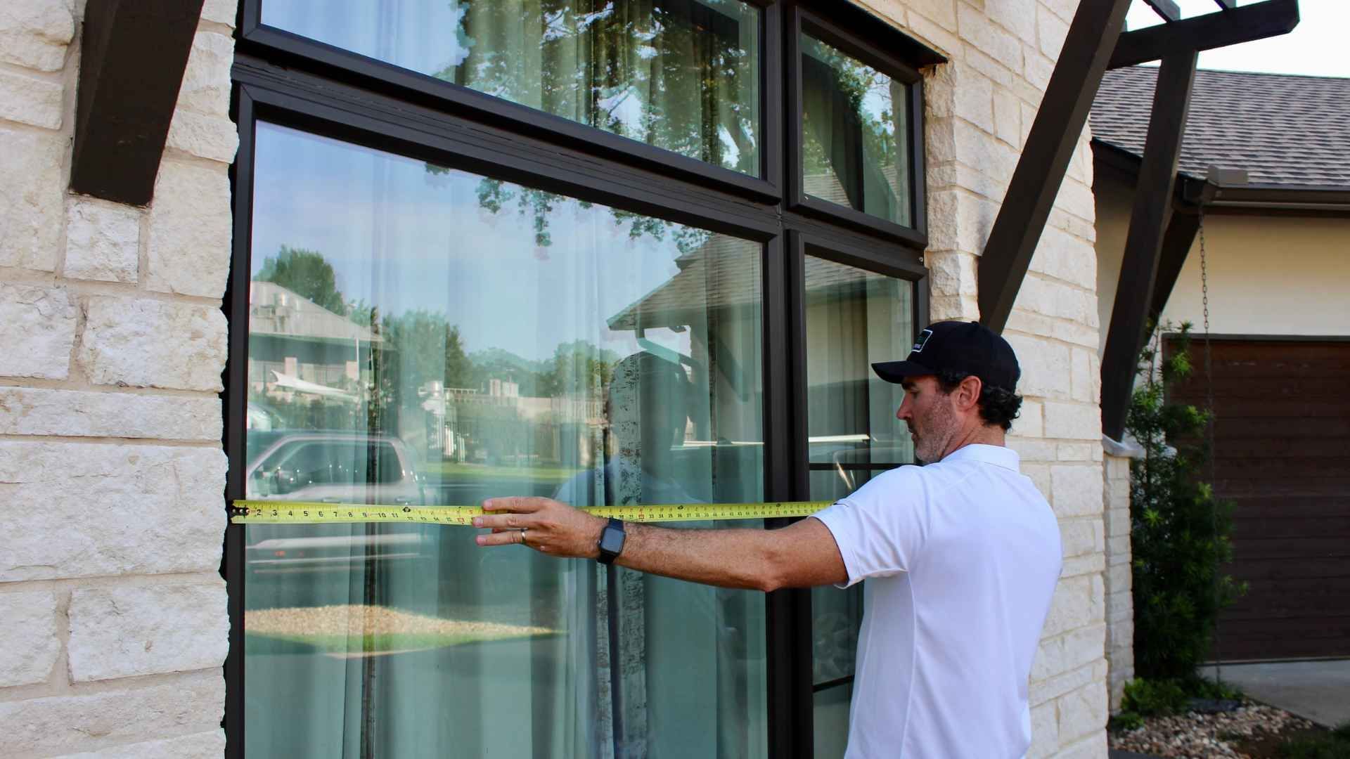 A spacious interior area with large windows showcasing an outdoor view is captured in the image.