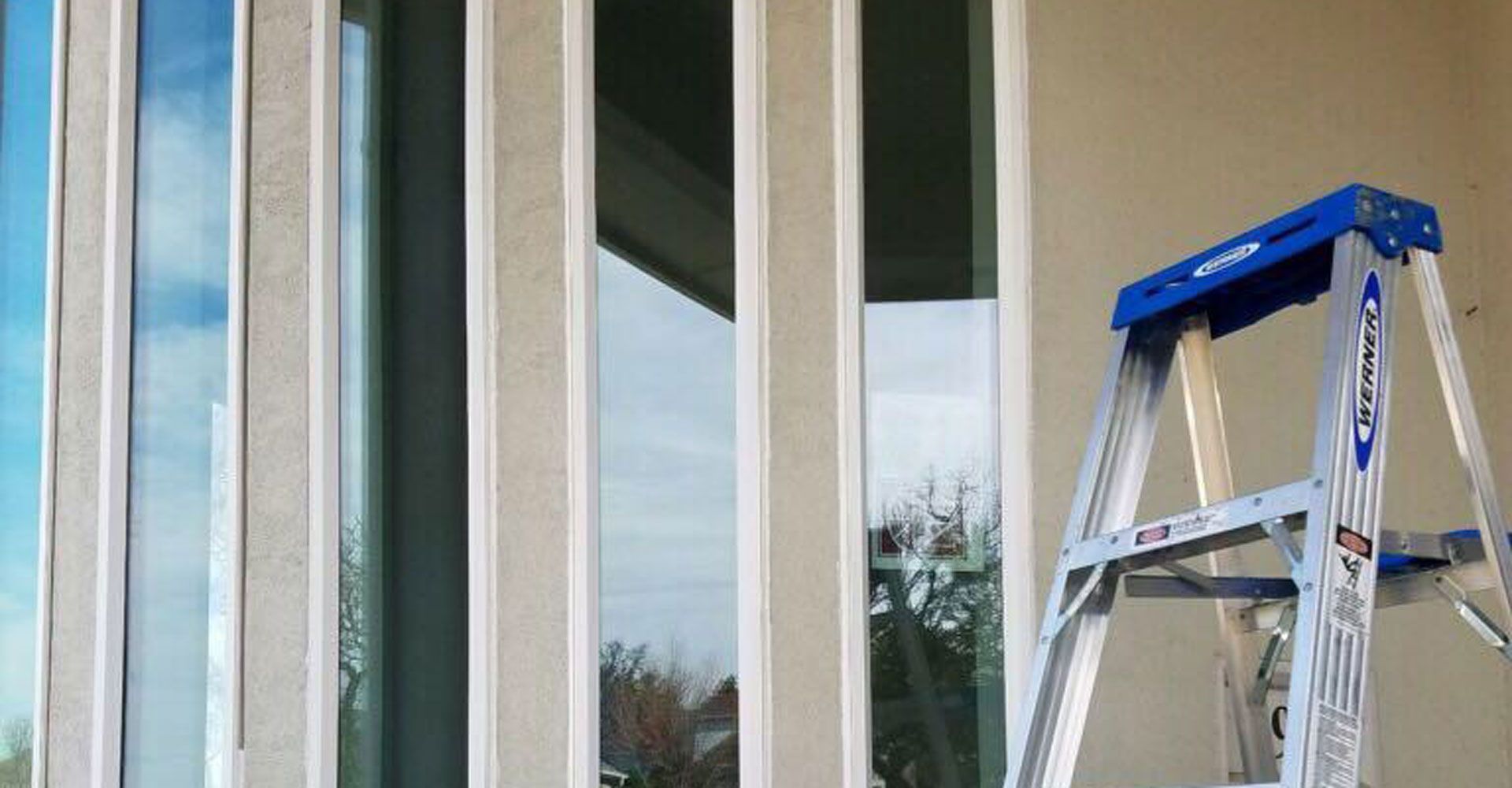 Window replacement expert is installing new energy efficient window.