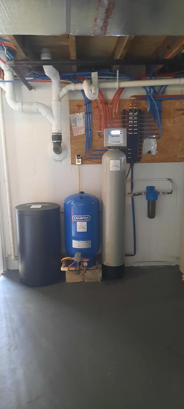 a champion water tank sits next to a blue tank
