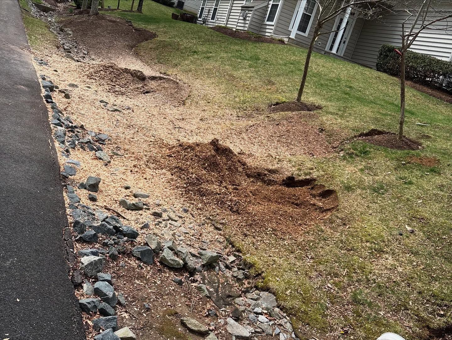 There is a lot of dirt and rocks on the side of the road.