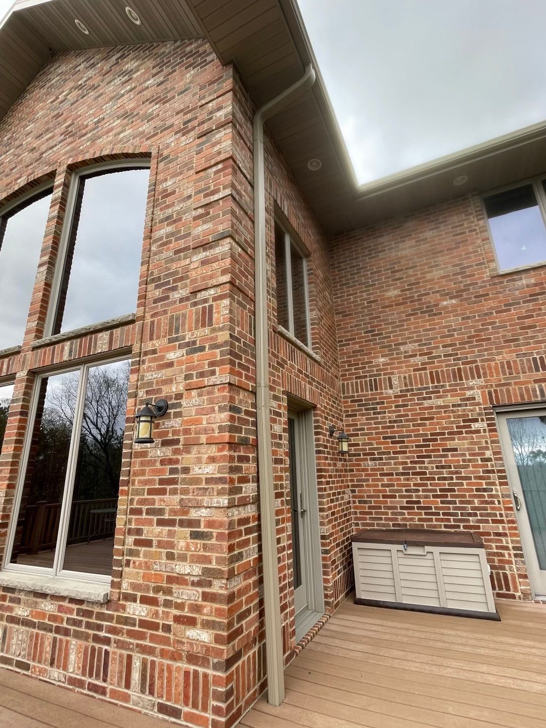 newly installed gutters on a brick home