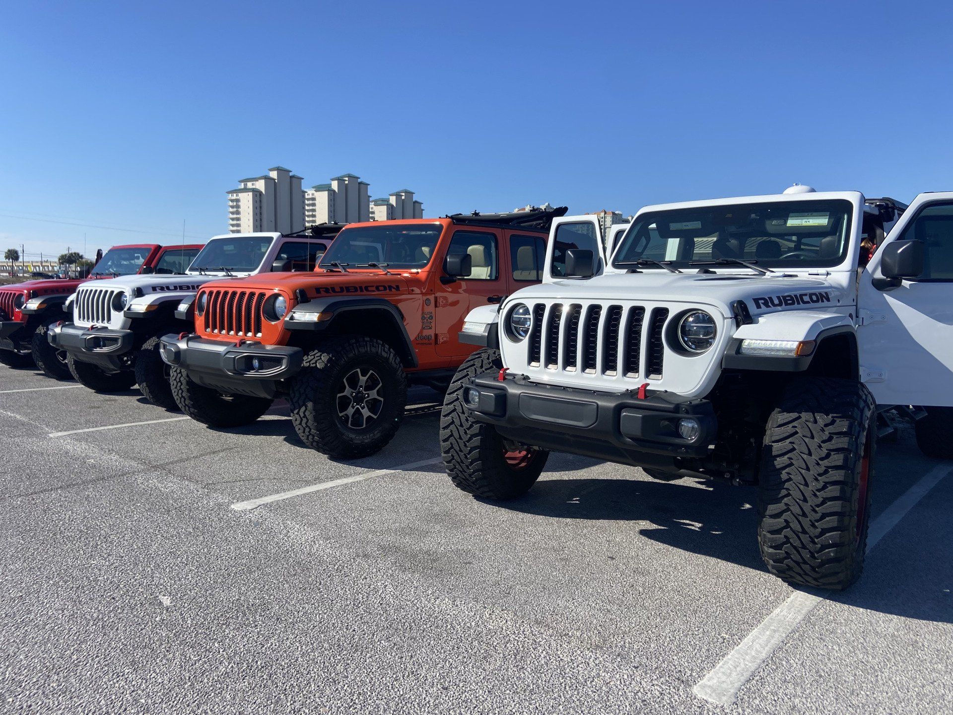 line of Jeeps in parking lot