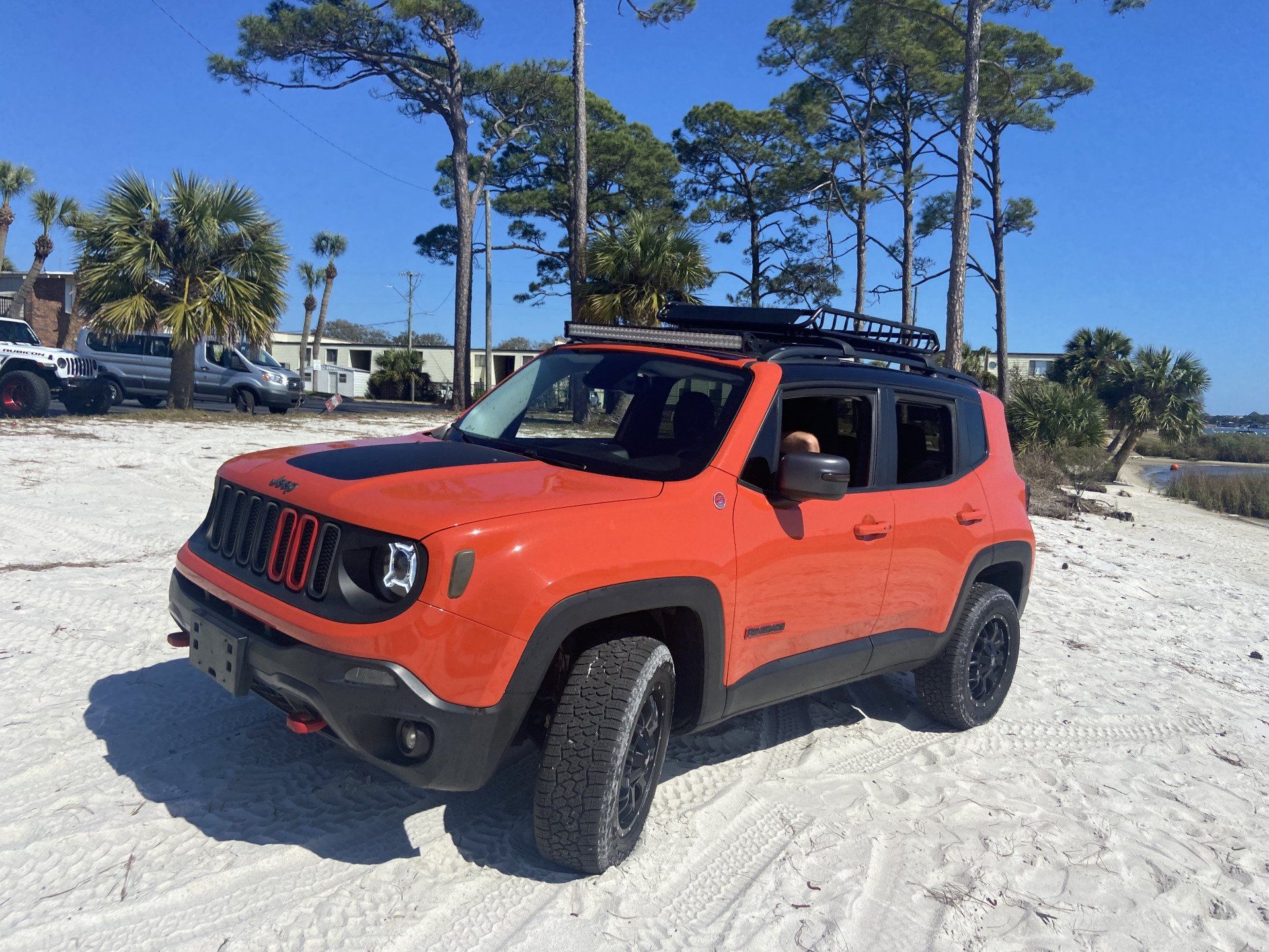 red orange jeep on beach