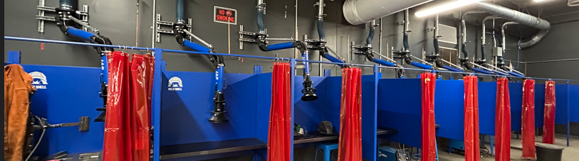 Weld shell welding booths with fume extraction arms