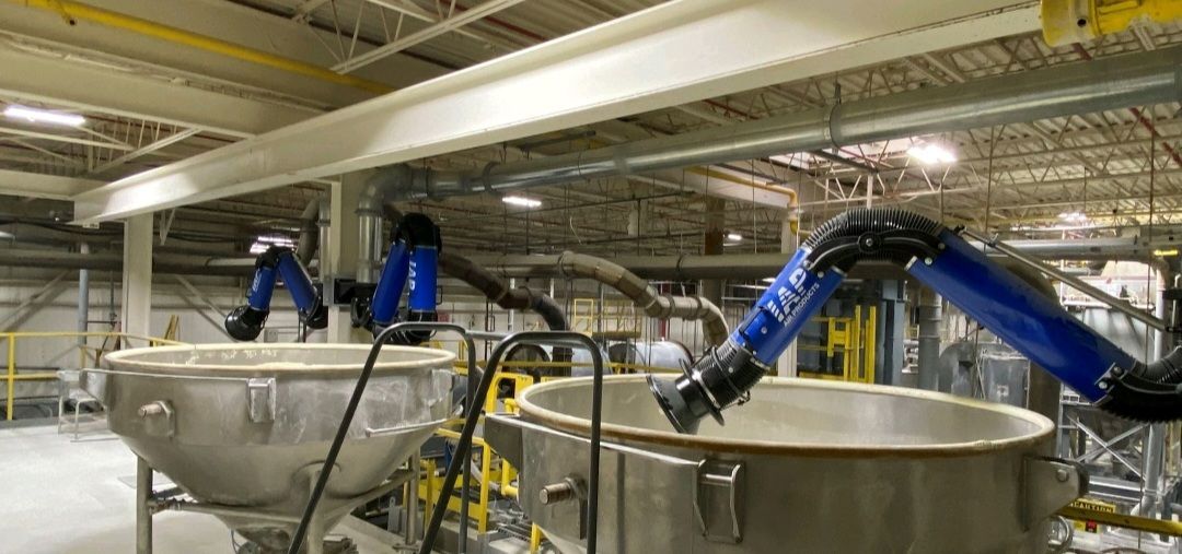 Extraction fume arms installed over vessels