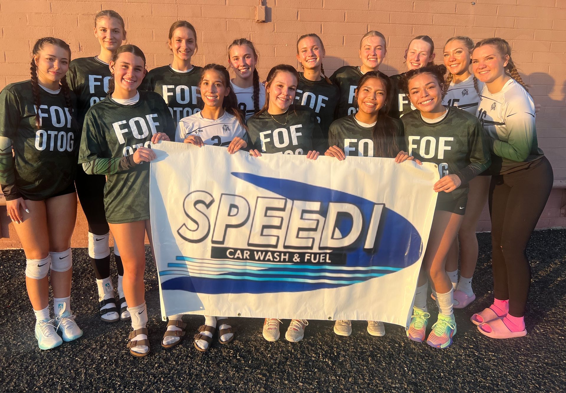 Volleyball team poses with