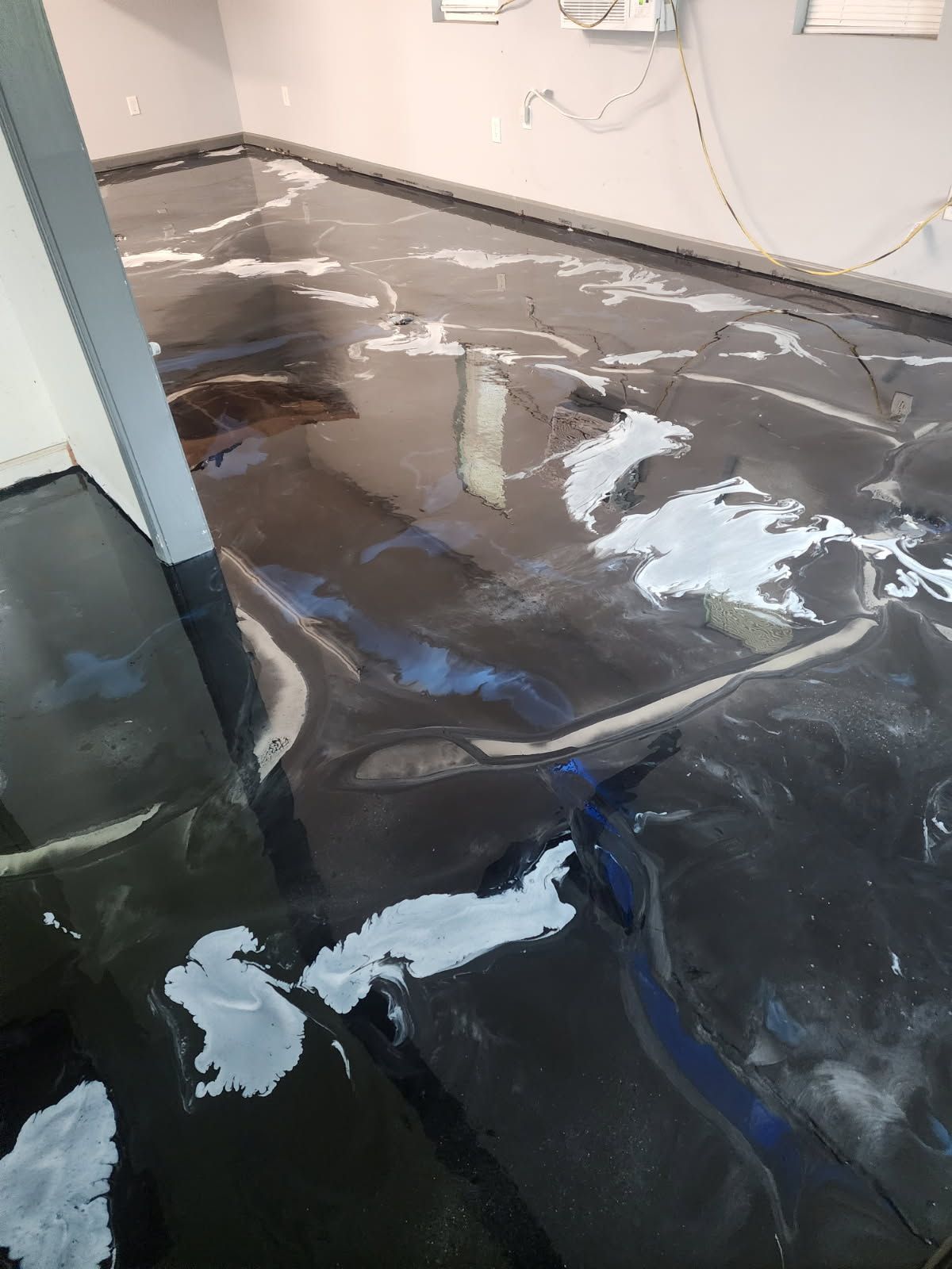 It looks like a swimming pool with a lot of water coming out of it.
