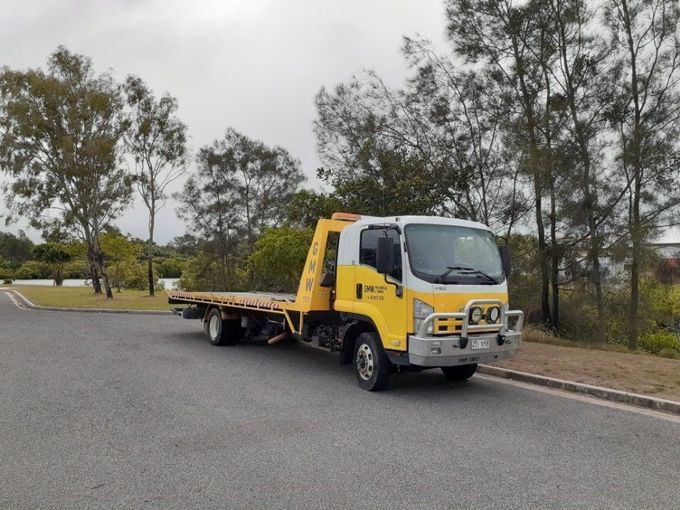 A Yellow Tow Truck Is Parked on the Side of the Road | Gladstone, QLD | GMW Towing