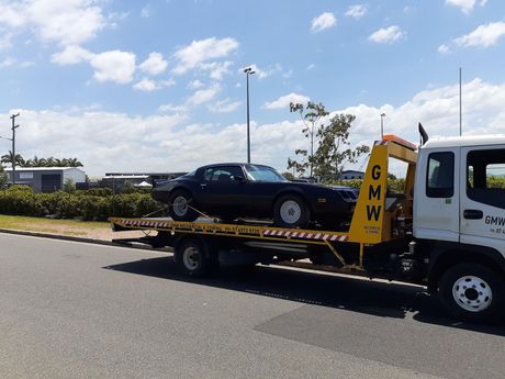 A White Van Is Being Towed by a Tow Truck | Gladstone, QLD | GMW Towing