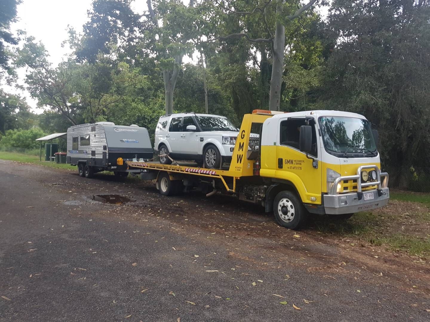 Two Men Are Towing a Broken Down Car on a Tow Truck | Gladstone, QLD | GMW Towing