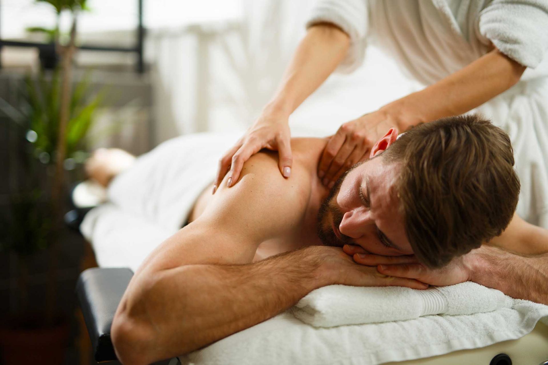 Bearded Man Getting a Massage — Miami, FL — Massage & Oriental Spa