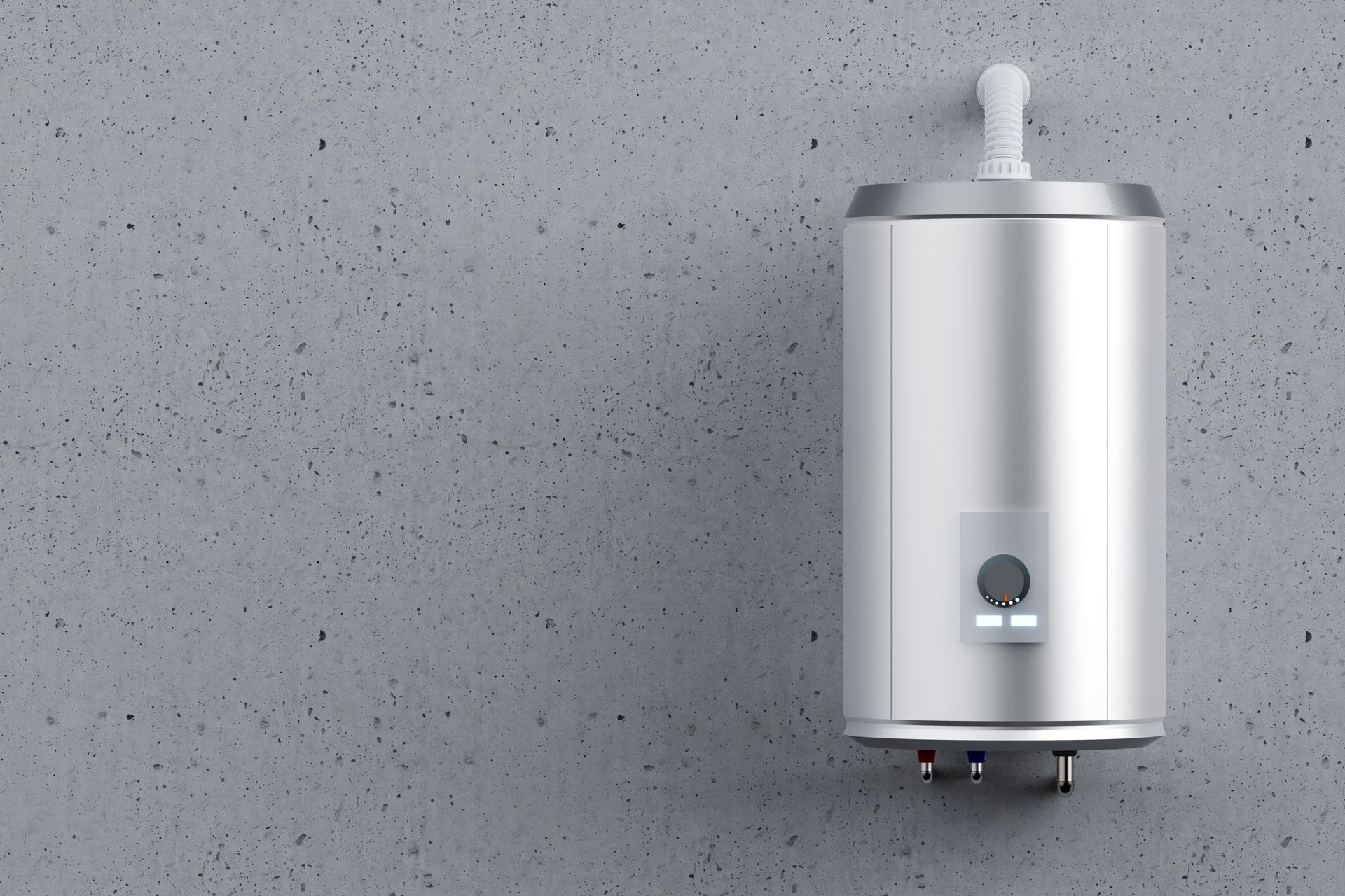 Silver water heater mounted on a gray concrete wall.