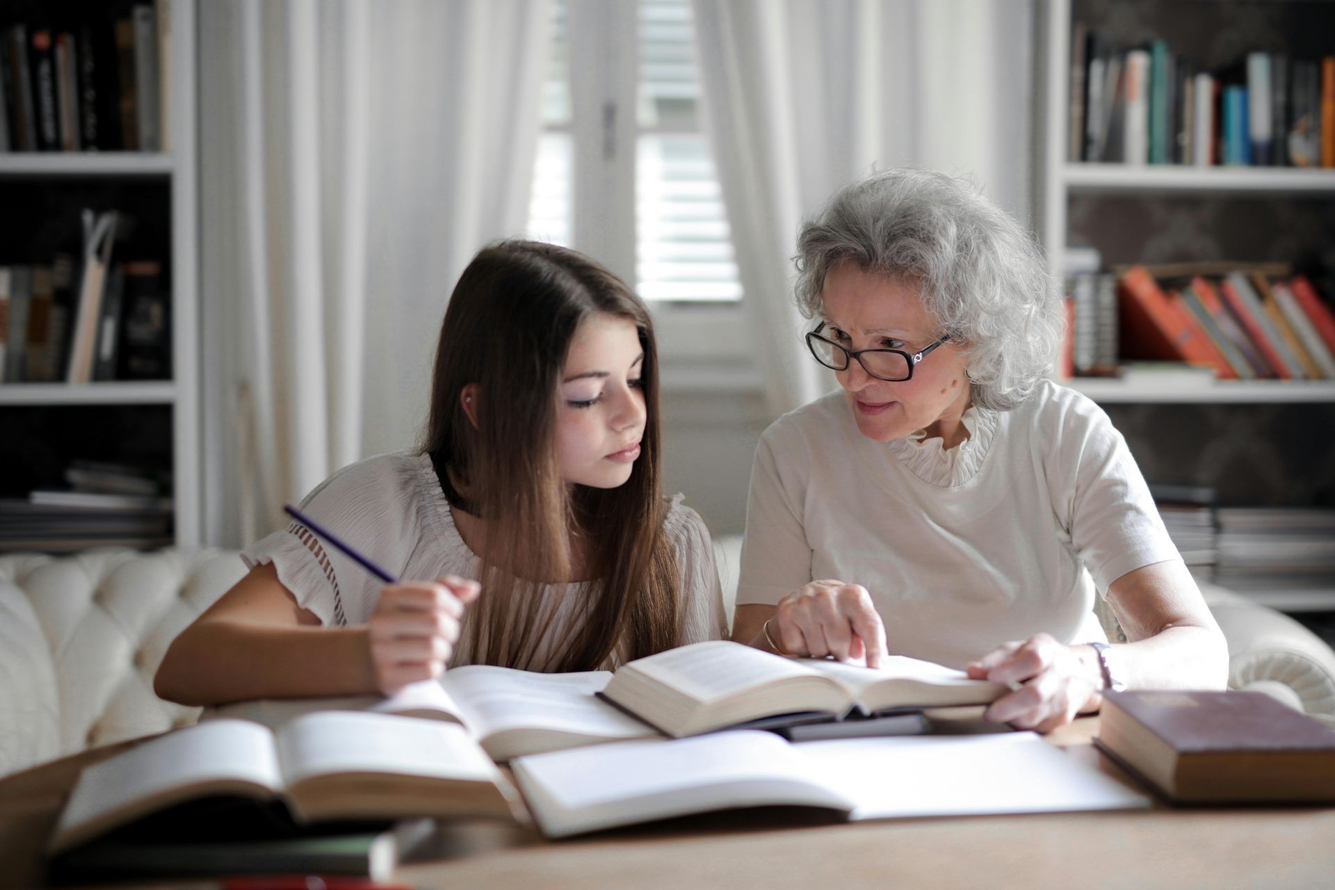 image of grandma and granddaughter together reading