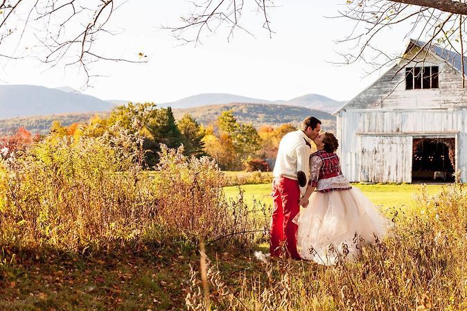 bride & groom out front of barn