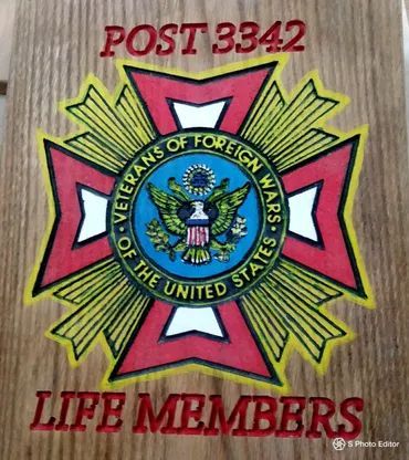 A wooden sign features the red, white, and gold Veterans of Foreign Wars logo with text reading