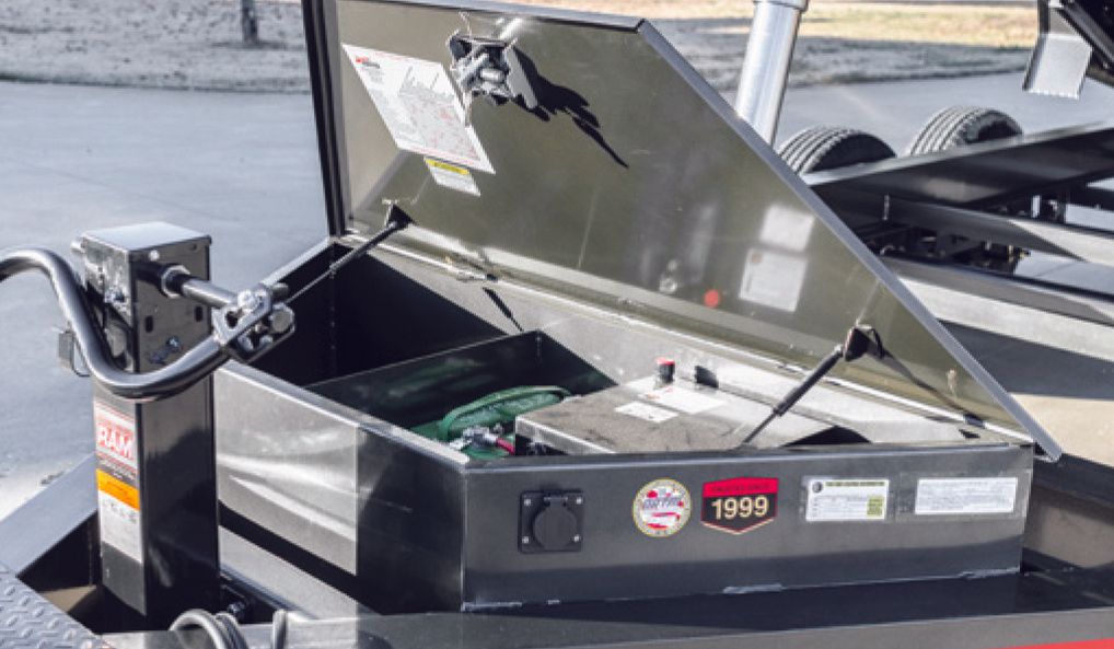 front of dumpster trailer with a built in tool box for convenience.