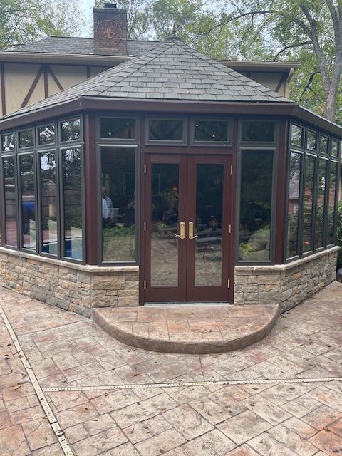 A gazebo with a lot of windows and doors