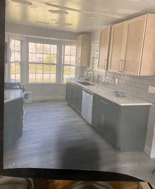A kitchen with a lot of cabinets and a sink.