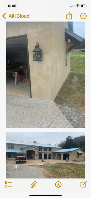 A phone screen shows a picture of a house and a garage.