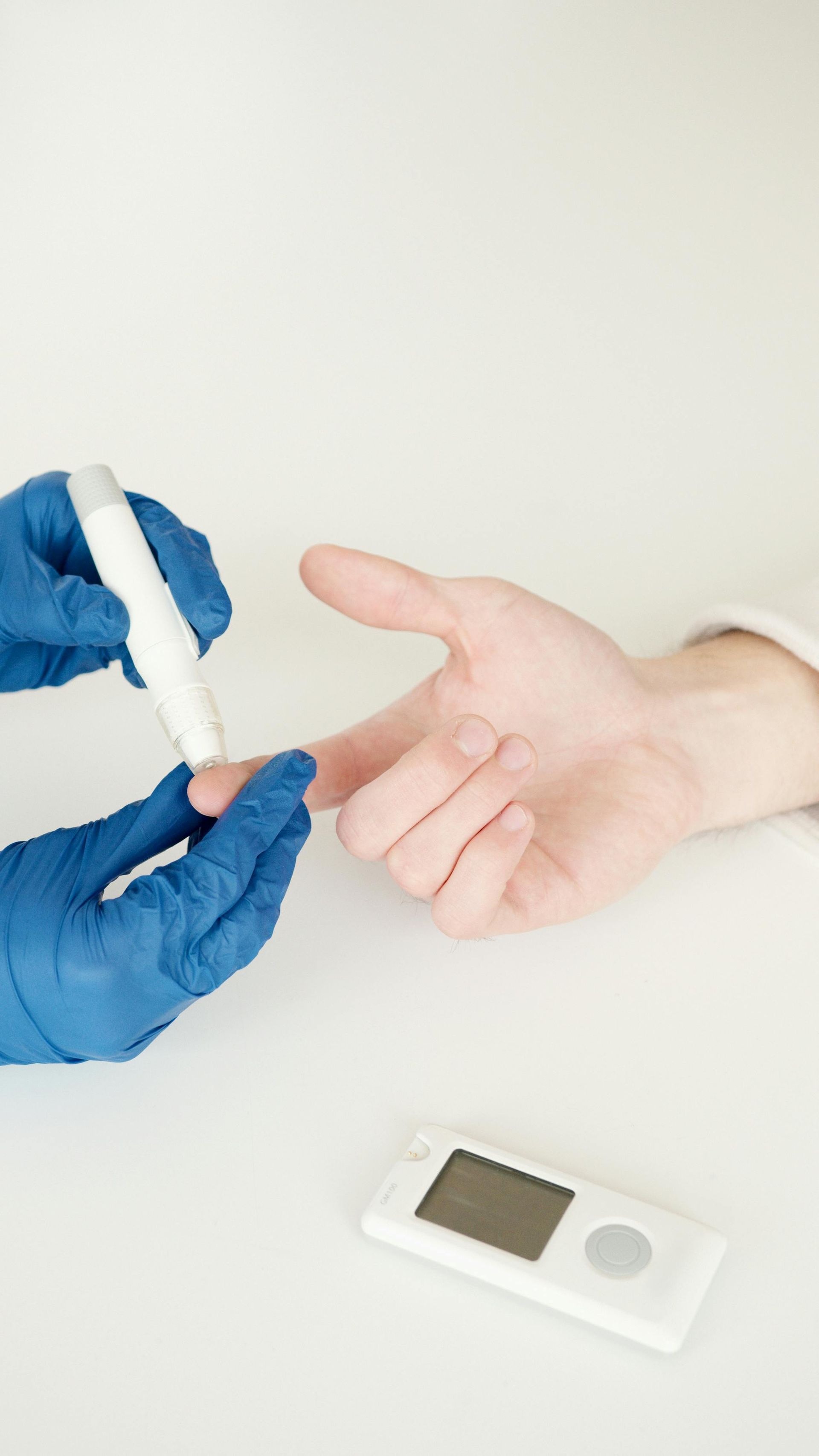 A person is being tested for diabetes by a doctor.