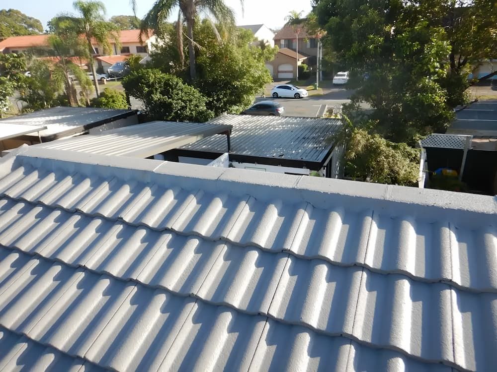 The Roof Of A House Has A Lot Of Tiles On It — Gold Coast Roof Repairs in Mudgeeraba, QLD