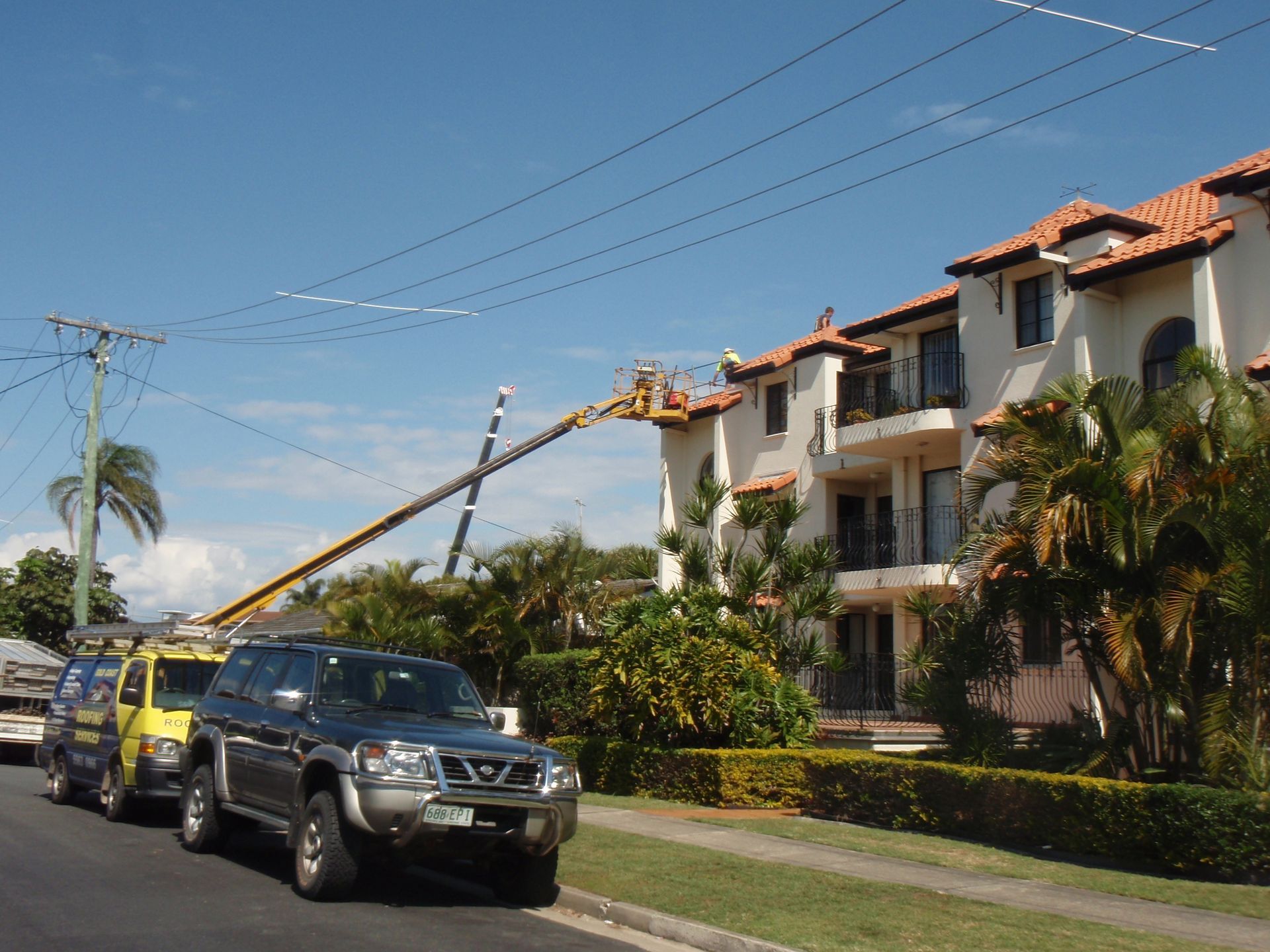 An Empty Roof Of A Building With A City — Gold Coast Roof Repairs in Mudgeeraba, QLD