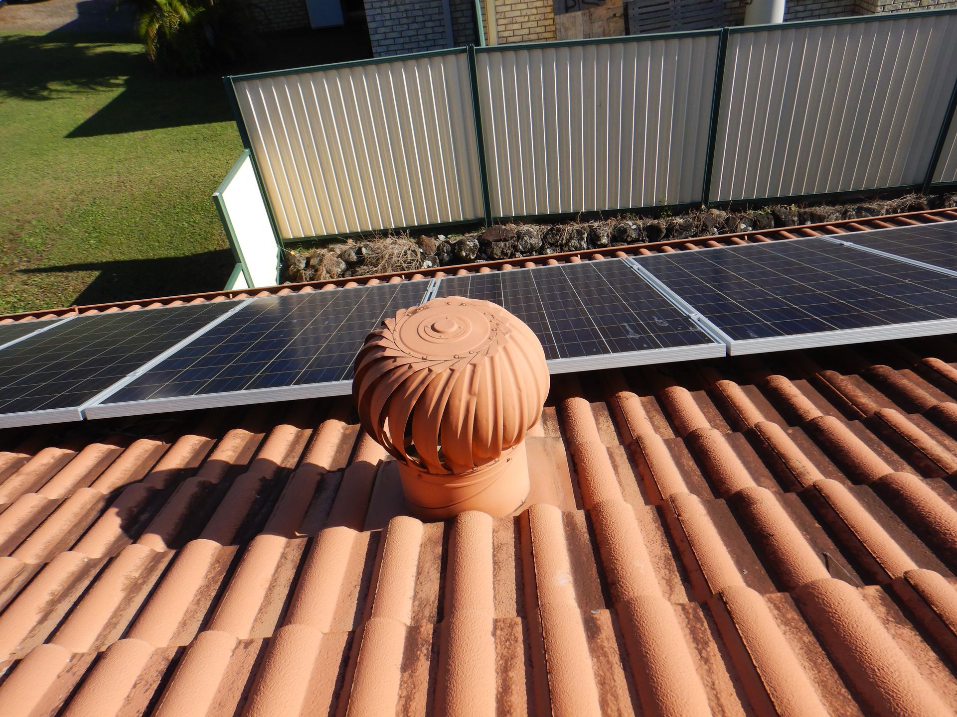 A Roof Vent On Top Of A Building With A Sunset — Gold Coast Roof Repairs in Mudgeeraba, QLD
